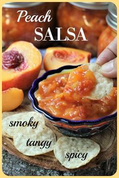 peach salsa in a bowl with crackers on the side