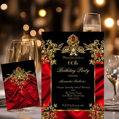 an elegant red and black birthday party with wine glasses, napkins and place cards