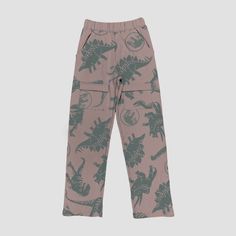 Your dino fan will love sporting these Jurassic Park Adaptive Jogger Pants. These mid-rise jogger pants are made from lightweight, stretchy fabric with a full elastic waistband for all-day comfy movement. Featuring two front cargo pockets with hook-and-loop fasteners, these pull-on jogger pants boast an allover print of green dinosaurs and Jurassic Park logos for a fan-favorite look. Jurassic Park Logo, Shipt Shopper, Dusty Rose Pink, Jurassic Park, Bottom Clothes, Rose Pink, Stretchy Fabric, Dusty Rose, Dinosaurs