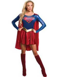 a woman in a superman costume standing with her hands on her hips