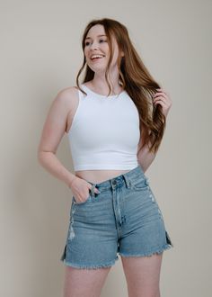 Get ready for all-day comfort with this Everyday Cropped White Tank. Perfect for layering under tops or wearing on its own, it's seamless, soft, and ultra-versatile. Fabric: 92% Nylon, 8% Spandex Care: Hand Wash, Lay flat to dry Model: Model is 5"6, wearing a size S/M Stretch Tops With Built-in Bra For Layering, Athleisure Crop Top For Spring Layering, Casual Seamless Crop Top With Minimal Stretch, Athleisure Stretch Crop Top For Layering, Stretch Athleisure Crop Top For Layering, Versatile Spring Tops With Seamless Construction, High Stretch Spring Tops For Everyday, Casual Short Length Elastane Top, White Tank Crop Top For Layering