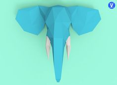 an elephant's head made out of paper on a green background with the word v above it