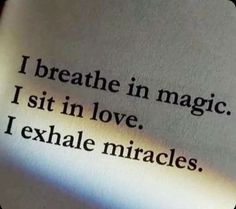 an open book with the words i breathe in magic, sit in love, i exhale mirages