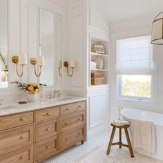 a bathroom with two sinks and a bathtub