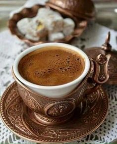 a cup of coffee sitting on top of a saucer