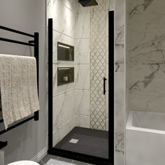 a bathroom with marble walls and flooring