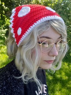 a woman wearing glasses and a knitted hat