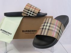 FURLEY BLACK RUBBER BEIGE VINTAGE IP CHECK LOGO SANDAL SLIDES By BURBERRY 100% AUTHENTIC, GUARANTEED !!! Color: Archive Beige (print on the box) Article: 8023965 1013 Nova IP Check Print Upper Open Toe "BURBERRY" Lettering Print Logo On both Sides Slip-On Style Comfy Molded Footbed "BURBERRY" Stamped Lettering Logo Rubber Sole Size: EUR 42 / UK 8 / US 9 Original Price: $ 395 NOTE !!! These slides came from a Burberry store in its original box.  They are new but they are in-store item and it’s possible that somebody tried them on inside the store. This could cause tiny exterior imperfections or marks on outsoles that are invisible when you wear them. They are new, in great condition, but we are stating them as a “new in box - in store item”. NOTE!!!!! International Buyers: Import duties, ta Burberry Slides, Burberry Gym Shoes, Burberry Clothing For Men, Burberry Rebrand, Burberry Store, Burberry Accessories, Mens Shoes Sandals, Burberry London, Mens Slippers