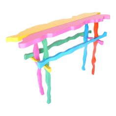 a colorful bench made out of sticks and plasticine on a white background with clippings