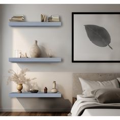 a bedroom with two floating shelves above the bed