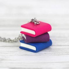 Subtle Pride Book Stack Necklace - Bisexual – Shana Logic Pride Jewelry Diy, Polymer Clay Chain, Bisexual Jewelry, Clay Chain, Tiny Books, Pride Necklace, Bisexual Pride Flag, Pride Flag Colors, Pride Jewellery