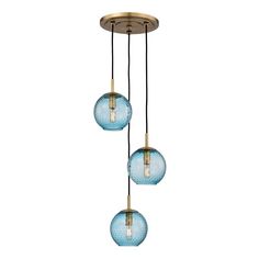 three blue glass globes hanging from a brass ceiling fixture with two lights on each side