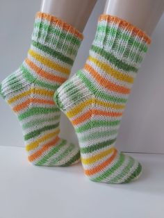 "Hand knitted women acrylic thick socks    Winter socks Knitted socks Multicolored  socks   Vegan socks Ready to ship I hand knit my socks in the round on 5 double pointed needles so there are no seams. The heel is made with a pattern. Length(toe to heel):9 1/2\"( 24,1 cm) 100% Acrylic Hand wash,dry flat. Made in my smoke free home. See your local sizes in the chart,photo #5 The brightness and shade of the colors may be slightly different from what you see on your computer" Casual Handmade Green Socks, Casual Green Knitted Socks, Comfortable Handmade Green Socks, Knitted Socks, Double Pointed Needles, Winter Socks, Thick Socks, Socks And Hosiery, Knitting Socks