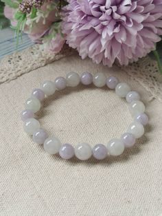 Jadeite Jade Beaded Bracelet description Item Code : JBB1168 Link to view item video : Round Beads : 9.3MM(11pcs-White), 7.9MM(11pcs-Lavender) Colour : White & Lavender Transparency : Icy Translucent Design : Sphere Round Beads. Comments : No visible stone line and no rough surface on this beaded bracelet. Remarks : Come in set of Gift box, extra Elastic String, Polishing Care Cloth and Type A Guarantee Card. *This jade Beaded Bracelet is 100% natural, untreated and undyed Type-A jadeite jad Jade Bead Bracelet, Lilac Stone, Hope Diamond, Lavender Colour, Girly Bracelets, Translucent Design, Crystal Bead Jewelry, White Lavender, Diy Bracelet Designs