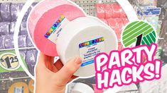 someone is holding up a pink and white party hacket in front of some shelves