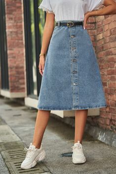 Introducing our Button Front A-Line Denim Skirt, the perfect addition to your casual wardrobe. This unique skirt features a solid pattern and a flattering A-line hem shape, giving it a stylish and versatile look. Made from a blend of 95% rayon and 5% polyester, this skirt is both comfortable and durable. The standout feature of this skirt is the button front design, adding a touch of vintage charm to the overall look. It also comes in a midi length, making it suitable for various occasions. And Hipster Skirt, Button Front Denim Skirt, A Line Denim Skirt, Unique Skirts, Skirt With Buttons, Denim Patterns, Mid Length Skirts, Denim Midi Skirt, Denim Button Down