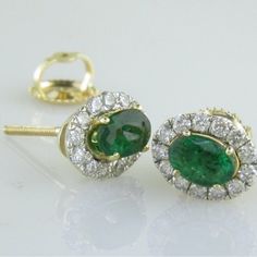 These 14k Yellow Gold Earring Mountings Hold (2) Oval Cut Emeralds Weighing .75ctw Along With .42ctw Of Si Clarity G/H Color Natural Diamonds. The Mountings Also Feature Screw Back Posts For Added Security. Luxury Oval Cluster Earrings For Anniversary, Emerald Yellow Gold Diamond Earrings Fine Jewelry, Emerald Yellow Gold Diamond Earrings, Oval 14k Gold Earrings With 17 Jewels, Elegant Oval Cluster Earrings In Yellow Gold, Gia Certified Fine Jewelry Cluster Earrings, Exquisite Yellow Gold Gia Certified Jewelry, 14k Gold Cluster Earrings Fine Jewelry, Gia Certified 14k Gold Oval Jewelry