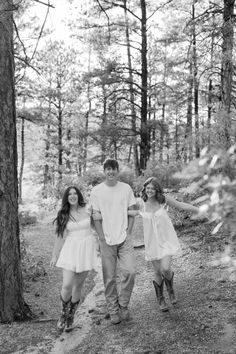 a family walking through the woods together