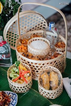 several baskets filled with food sitting on top of a table