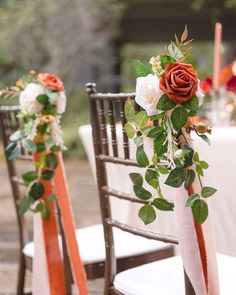 the chairs are decorated with flowers and ribbons