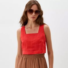 Exude summer vibes with this sleeveless top, perfect for those warm days and balmy nights. Crafted with impeccable attention to detail, our linen crop top is the embodiment of modern elegance. The square neck design brings a touch of sophistication, while the back buttons add a dash of vintage charm. Made from premium quality linen, this top ensures you stay cool and comfortable all day long. Whether you're off to a brunch or a beach outing, this sleeveless beauty pairs seamlessly with skirts, jeans, or shorts. Elevate your summer wardrobe with this essential, versatile piece. * Made from washed European blend linen (60% linen and 40% cotton) * OEKO-TEX certified fabric (no harmful chemicals used in production) * From XS to Plus size * Perfect choice for summer TAKING CARE: * machine wash Chic Linen Crop Top For Spring, Chic Cropped Linen Tops, Sleeveless Linen Crop Top For Summer, Chic Sleeveless Blouse Crop Top For Day Out, Chic Cropped Tank Top For Summer, Chic Crop Top Tank Top For Vacation, Chic Sleeveless Crop Top For Day Out, Sleeveless Linen Crop Top For Spring, Summer Cropped Linen Tank Top