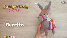 an amigurmus stuffed animal being held up by someone's hand with the caption, burrito