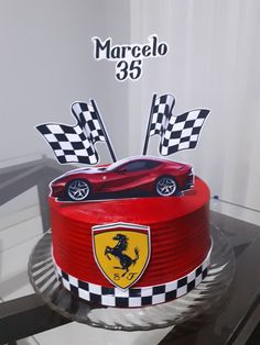 a birthday cake with a ferrari car on it