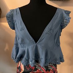 Nwt Free People Crop Top, Sz Cl. Cute Beading. Has A Lot Of Stretch To It. Great Color And Wonderful For Summer. Retail $58. Elegant Light Blue Top For Beach, Summer V-neck Beaded Top, Summer Beaded V-neck Tops, Beaded V-neck Tops For Summer, Beaded V-neck Top For The Beach, Summer Vacation Tops With Sequins, Summer Vacation Sequin Tops, Sequin Tops For Summer Vacation, Light Blue V-neck Party Top