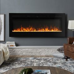 a living room with a couch, chair and fire place in the wall above it