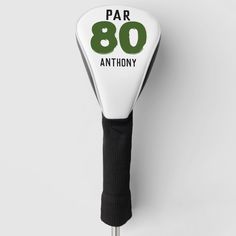 a white and black golf club headcover with the number 80 on it