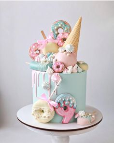 there is a cake decorated with donuts and other things