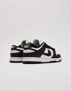 The Nike Dunk Low is the '80s basketball classic that you know and love. With clean colorblocking and durable materials, this black-and-white "Panda" colorway is a must-have in your collection. Leather upper Swoosh overlays at sides Colorblocked design Traditional lacing system Padded tongue with Nike branding Cushione Nike Dunk Low Next Nature, 80s Basketball, Nike Branding, Nike Brand, Nike Dunk Low, Dunk Low, Nike Dunk, Nike Dunks, Nike Women