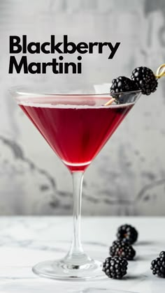 the blackberry martini is garnished with blackberries