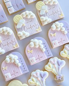 cookies decorated with pastel pink and white icing