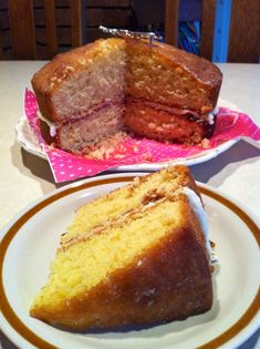 two slices of cake sitting on plates next to each other