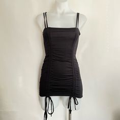 Good Condition. Stitching On Drawstring Loose As Pictured. Black Stretch Mini Dress With Drawstring, Black Fitted Mini Dress With Drawstring, Fitted Black Mini Dress With Drawstring, Black Stretch Dress With Drawstring, Black Stretch Dresses With Drawstring, Black Bodycon Mini Dress With Ruched Detail, Black Stretch Mini Dress With Ruched Sides, Club Mini Dress With Ruched Sides, Solid Color Ruched Mini Dress For Club