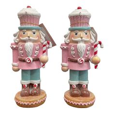 two christmas nutcrackers are standing next to each other