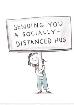 a woman holding a sign that says sending you a socially distance hug