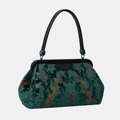 Crafted with carpet and luxurious lambskin leather, this semi-structured shoulder bag stands on its own for easy access, and it's closed with invisible magnets integrated within the frame complemented by cowhide leather patches for added flair.This is a design modified from the top handle purse by adding 4.50" to the handle drop, the handle drop of this purse is 9.50" which is perfect for shoulder carry. Overall measurements:• Bottom Width: 12-1/2"• Top Hinge Width: 11"• Depth: 4-3/4"• Height: 6 Green Shoulder Bag, Structured Shoulder, Large Travel Bag, Work Tote Bag, Burnout Velvet, Mens Travel, Mens Travel Bag, Work Tote, Bag Stand