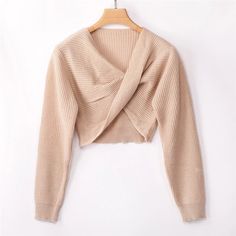 Beige V-neck Crop Top For Fall, Elegant Cropped Winter Sweater, Winter Cropped Sweater In Solid Color, Winter Cropped Sweater Solid Color, Trendy V-neck Cropped Sweater For Winter, Elegant Long Sleeve Winter Crop Top, Elegant Long Sleeve Crop Top For Winter, Winter Knit Crop Top, Winter Long Sleeve Ribbed Crop Top