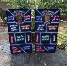 two game boards with neon signs on them