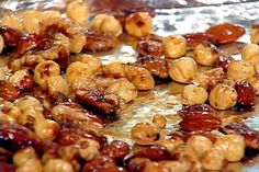 nuts and raisins are being cooked on tin foil