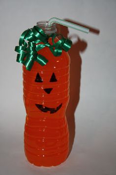 an orange plastic bottle with a green bow on it