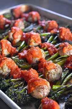 meatballs and broccoli covered in marinara sauce