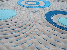 a blue and white rug with circles on it