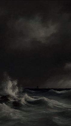 a boat in the middle of a large body of water on a stormy day with dark clouds