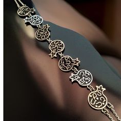 "Silver Armenian Pomegranate Alphabet Bracelet made from 925 Silver and adorned with sacred Armenian symbols. This timeless piece is a perfect addition to your collection." Armenian Symbols, Armenian Pomegranate, Alphabet Bracelet, Armenian Alphabet, Armenian Jewelry, Sacred Symbols, Armenia, Pomegranate, Arm Band