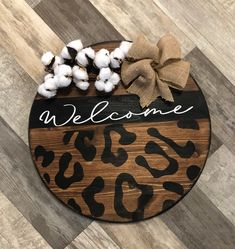 a welcome sign with cotton balls on it