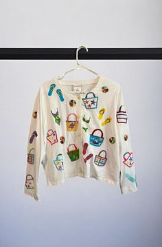 Vintage Michael Simon Long Sleeve Button Down Beach Novelty Print Shirt Size Tag Cut Out But Large Based On Measurements! Beachy Whimsical Print With Flip Flops, Beach Ball, Tote Bags, Etc Embroidered Button Down 100% Cotton Measures 22” Pit To Pit 21” Length Excellent Vintage Condition. Feels Unworn, No Flaws. Cotton Tops With Buttons For Beach Season, Cotton Button-up Tops For Beach Season, Summer Vacation Tops With Buttons, Spring Vacation Tops With Buttons, Summer Tops With Buttons For Vacation, White Long Sleeve Tops For Vacation, Cotton Tops With Buttons For Vacation, Spring Long Sleeve Beachy Tops, Beachy Long Sleeve Tops For Spring