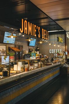 the inside of a restaurant with food on display